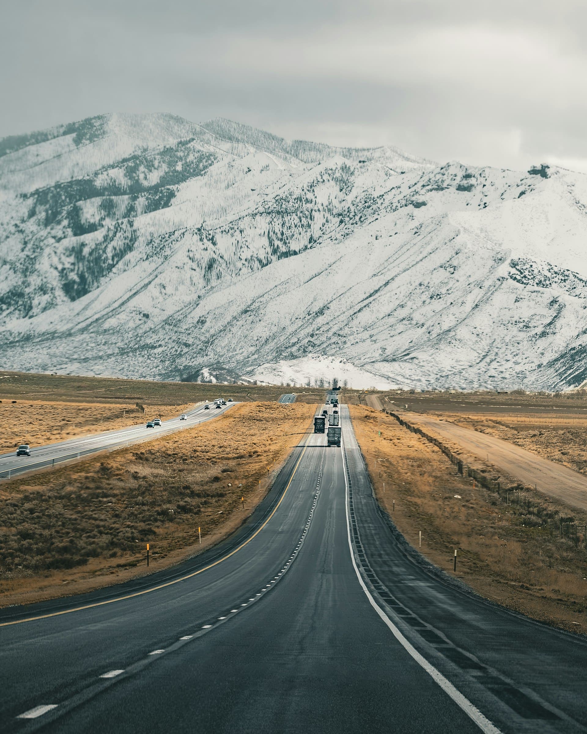 Semi truck driving through Utah mountains